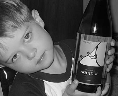 Aquinas wine held by Charlie