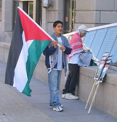 terrorist_sympathizer_with_palestinian_flag_sm.jpg